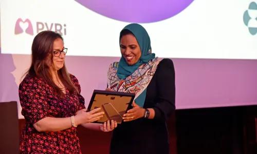 Hanan Yusuf Ahmed accepting their award