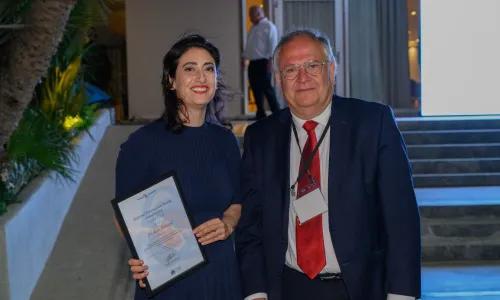 Azar Kianzad accepting their award